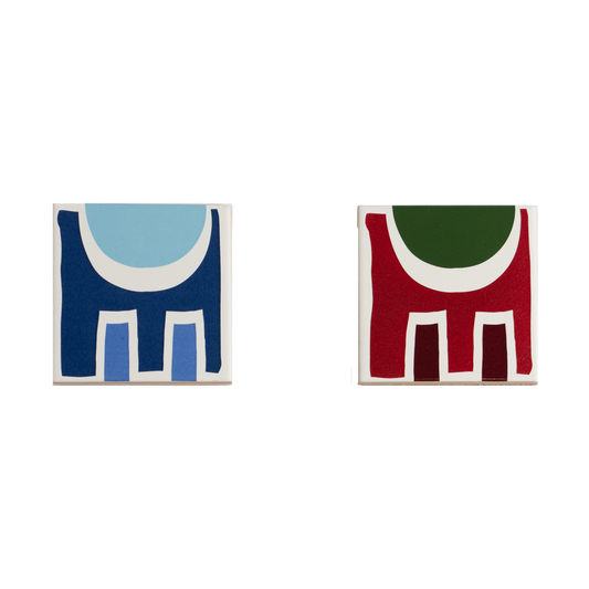 Porcelain coasters with abstract geometric shapes in a bold color palette.