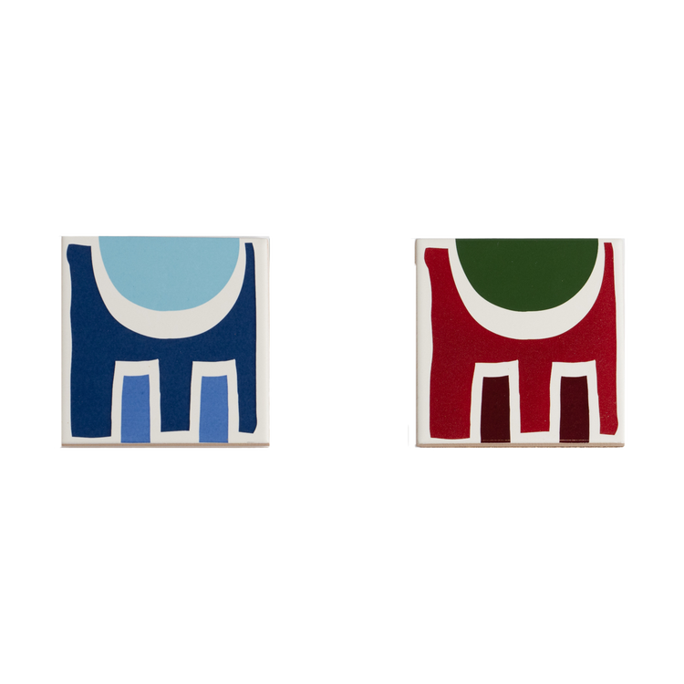 Porcelain coasters with abstract geometric shapes in a bold color palette.