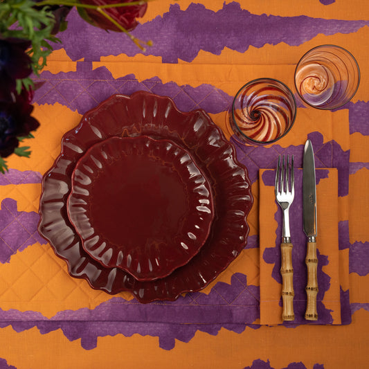 Linen Quilted Placemat in an orange tie-dye pattern