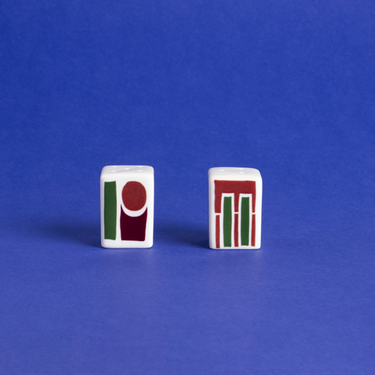 Porcelain salt & pepper shakers with abstract geometric shapes in a bold color palette.