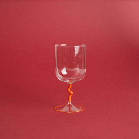 Handmade wine glass with orange spiral stem