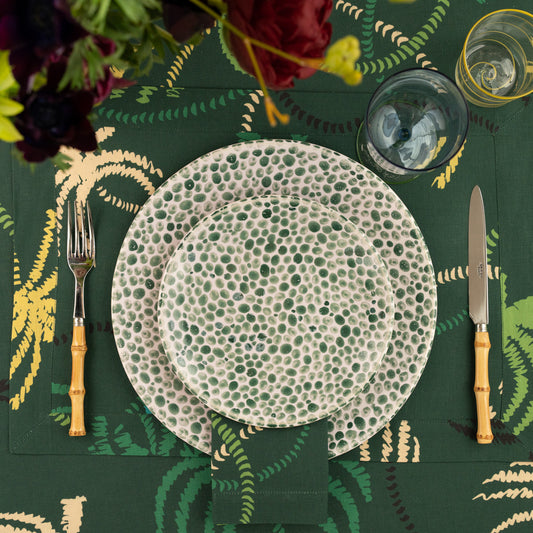 Linen Placemat in a dark green palm trees pattern